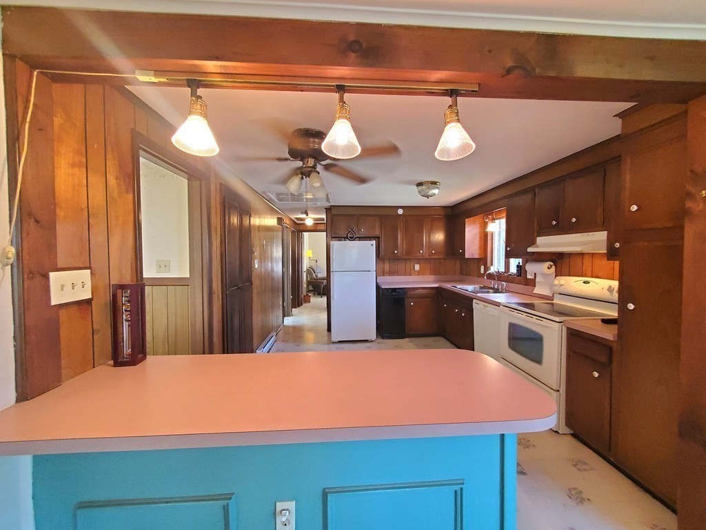 33 Marique Drive Lawrence, MA 01843 - Photo 7 of 20 a kitchen with a stove a kitchen island a sink cabinets and stainless steel appliances