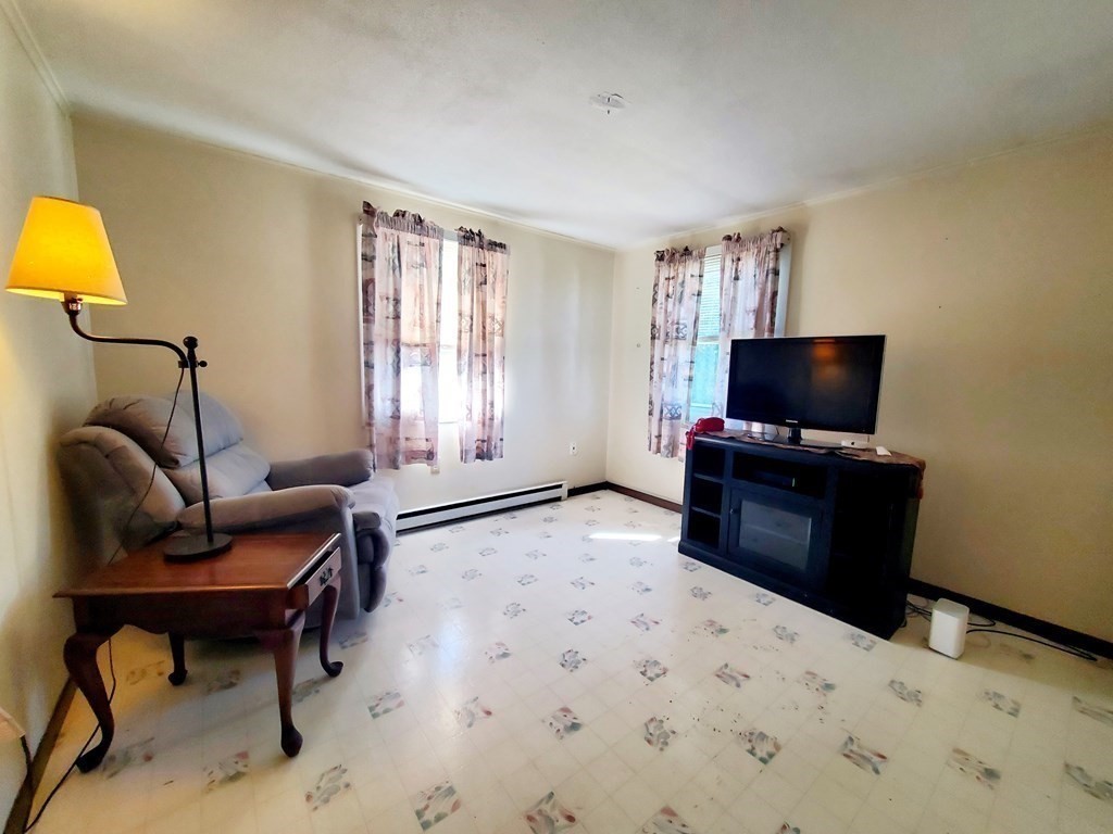 33 Marique Drive Lawrence, MA 01843 - Photo 9 of 20 a bedroom with furniture and a flat screen tv