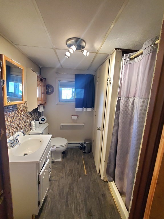 33 Marique Drive Lawrence, MA 01843 - Photo 10 of 20 a bathroom with sink a mirror toilet and bathtub