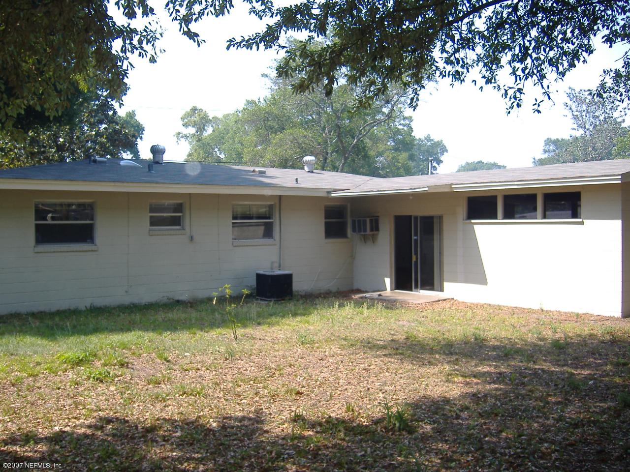 6829 Heidi Road Jacksonville, FL 32277 - Photo 2 of 9 a view of a house with a yard