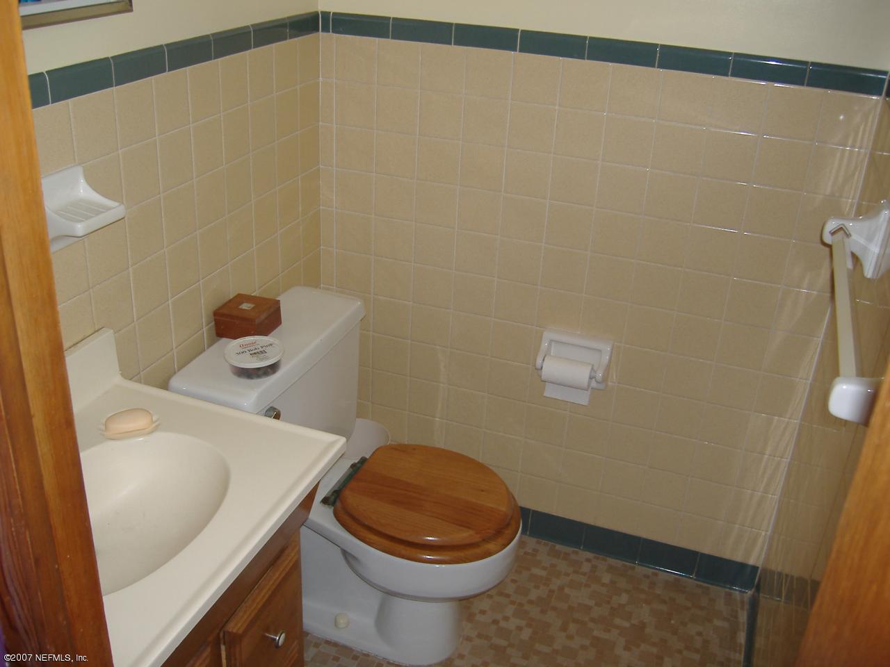 6829 Heidi Road Jacksonville, FL 32277 - Photo 9 of 9 a bathroom with a sink and toilet