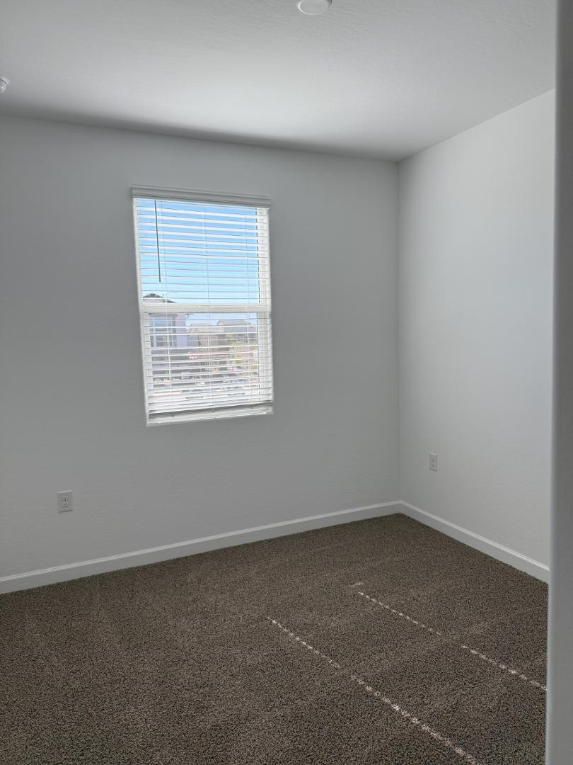 1840 West Spaulding Avenue Apache Junction, AZ 85120 - Photo 8 of 53 an empty room with a window
