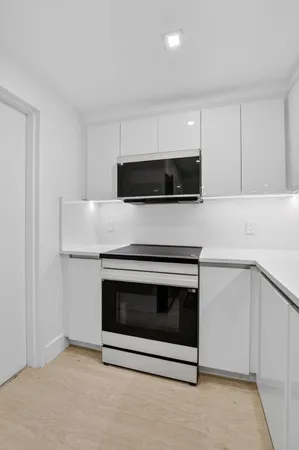 a kitchen with a stove and a microwave