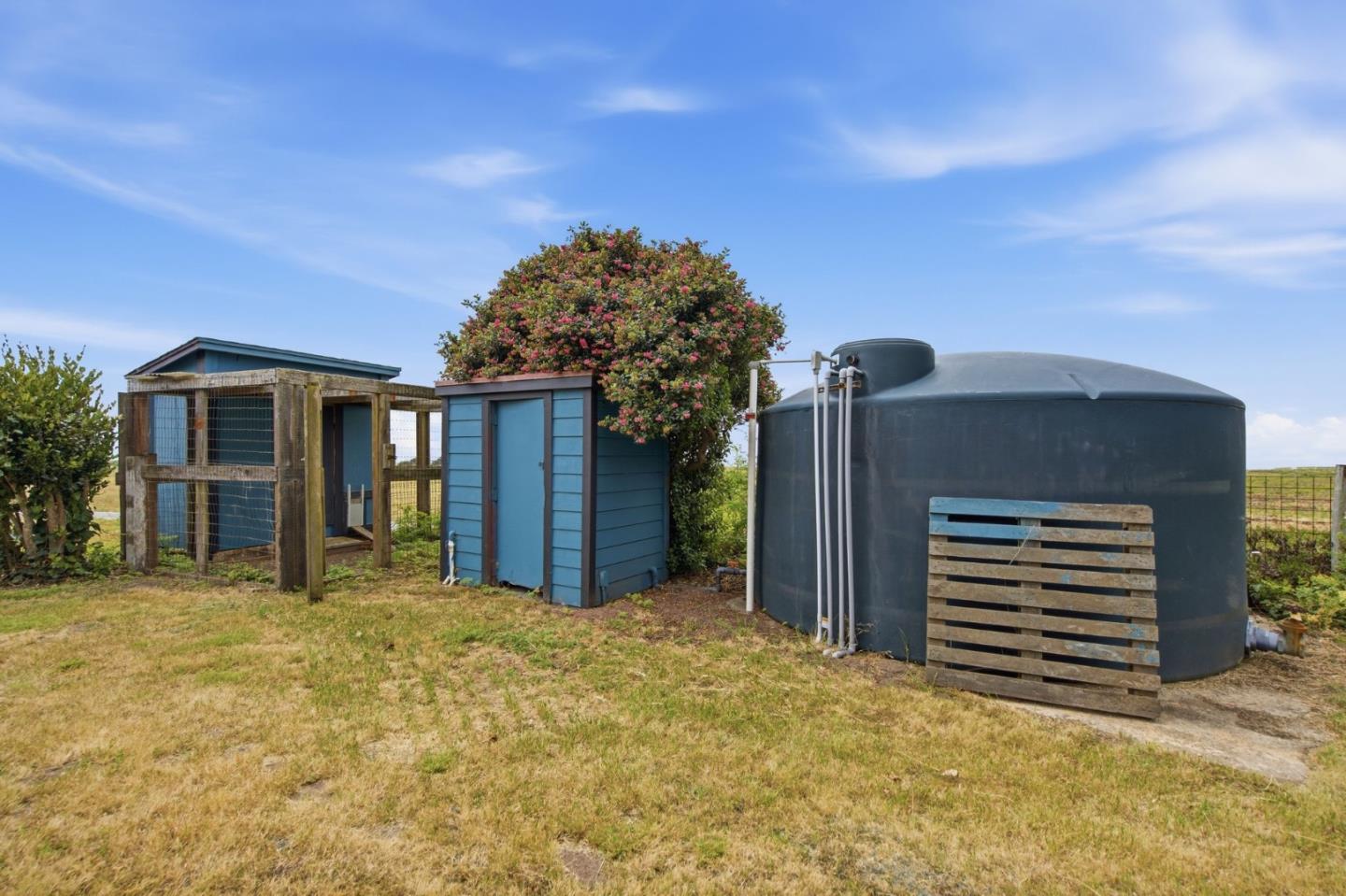 1263 Reservoir Road Pescadero, CA 94060 - Photo 66 of 66 a front view of a house with a yard