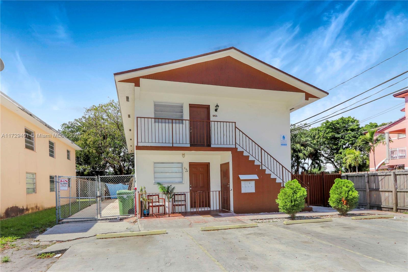 642 East 2nd Avenue, Unit A Hialeah, FL 33010 - Photo 1 of 27 a front view of a house with a yard