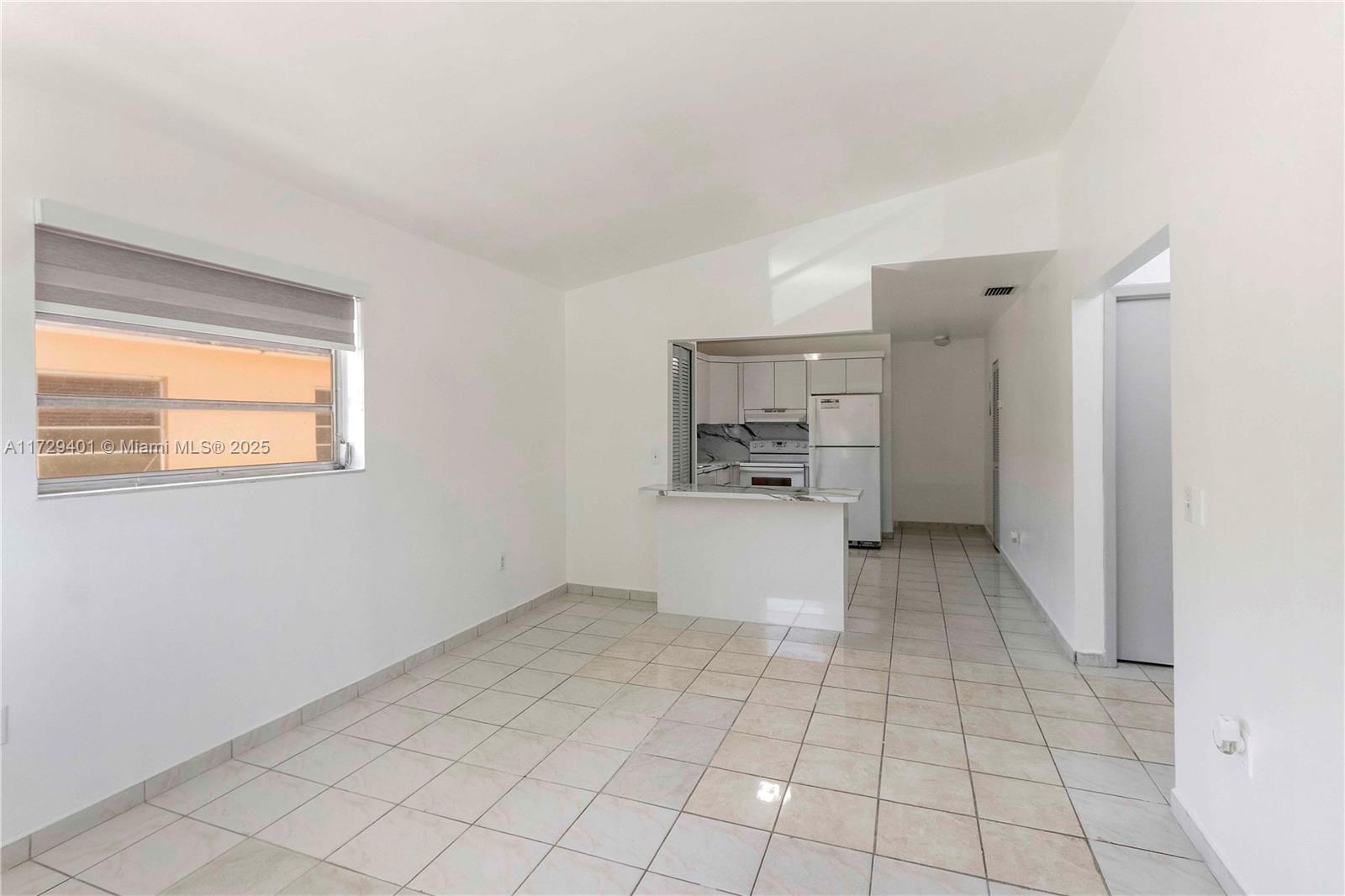 642 East 2nd Avenue, Unit A Hialeah, FL 33010 - Photo 11 of 27 a view of kitchen with furniture and window