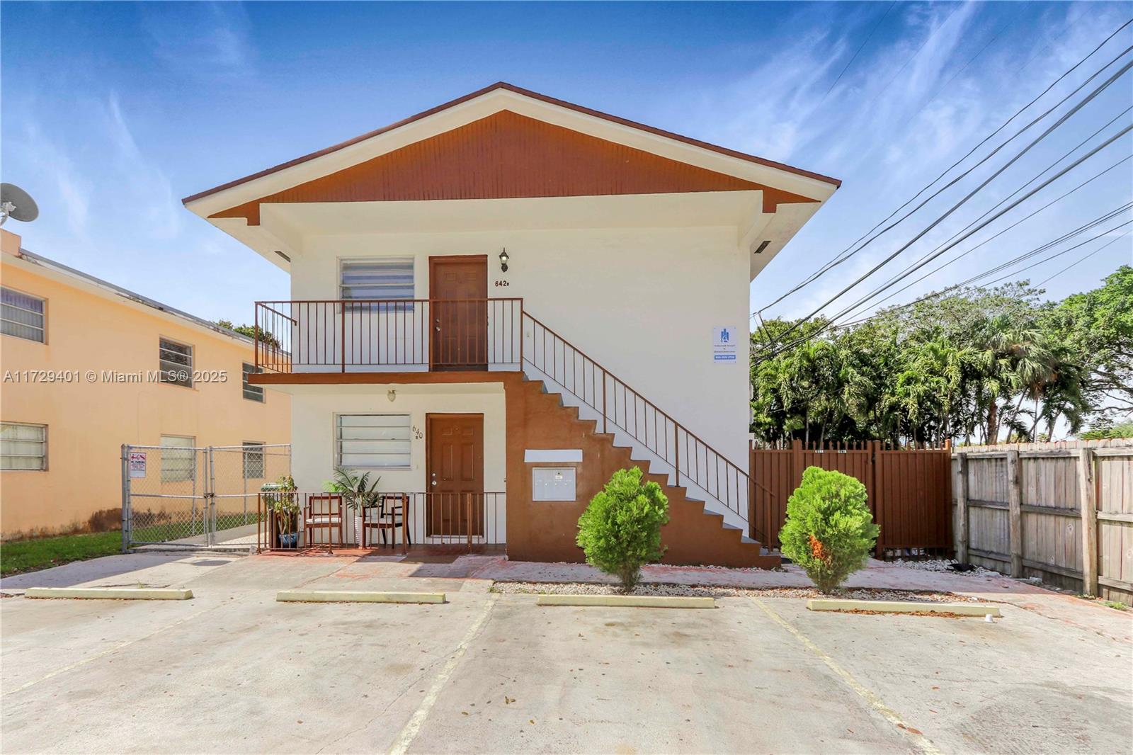 642 East 2nd Avenue, Unit A Hialeah, FL 33010 - Photo 19 of 27 a front view of a house with garden