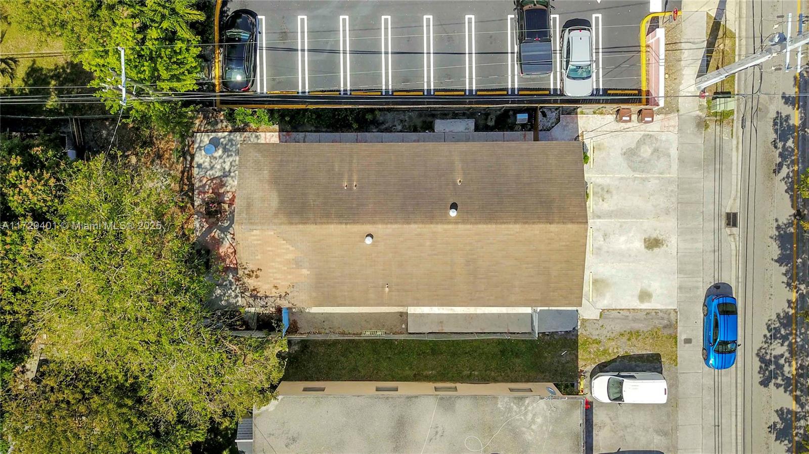 642 East 2nd Avenue, Unit A Hialeah, FL 33010 - Photo 25 of 27 a view of a building with a yard