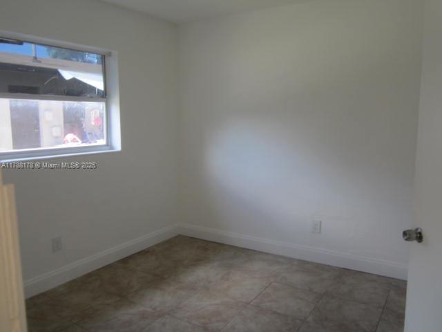 Collier City Pompano Beach, FL 33069 - Photo 13 of 53 a room that has a window