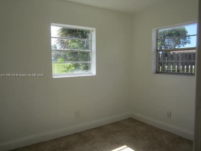 Collier City Pompano Beach, FL 33069 - Photo 17 of 53 an empty room with a window