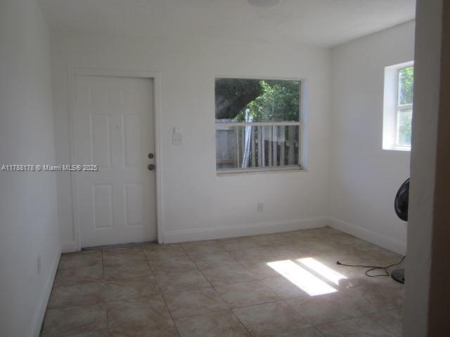 Collier City Pompano Beach, FL 33069 - Photo 2 of 53 a view of an empty room with a window
