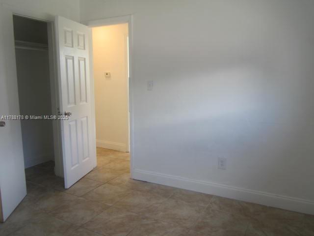Collier City Pompano Beach, FL 33069 - Photo 21 of 53 an empty room with windows