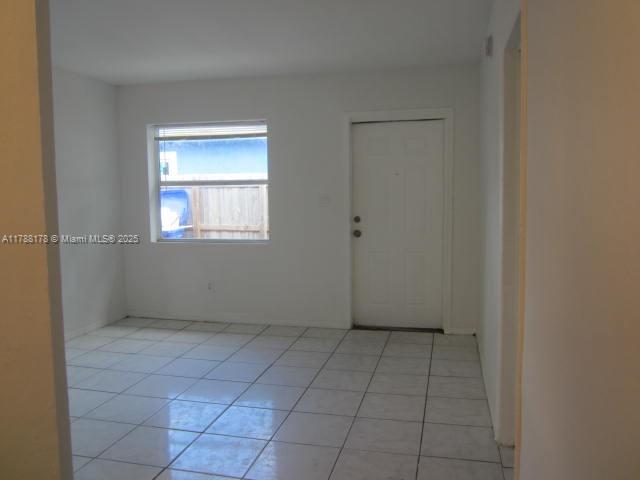 Collier City Pompano Beach, FL 33069 - Photo 30 of 53 a view of an empty room with a window