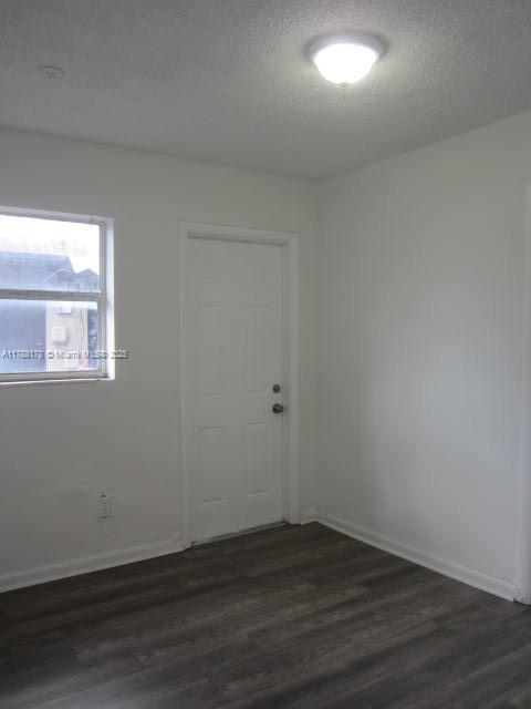 Collier City Pompano Beach, FL 33069 - Photo 31 of 53 a view of an empty room with wooden floor and a window