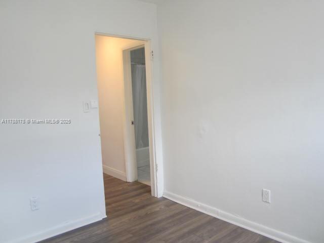 Collier City Pompano Beach, FL 33069 - Photo 32 of 53 a view of an empty room with wooden floor