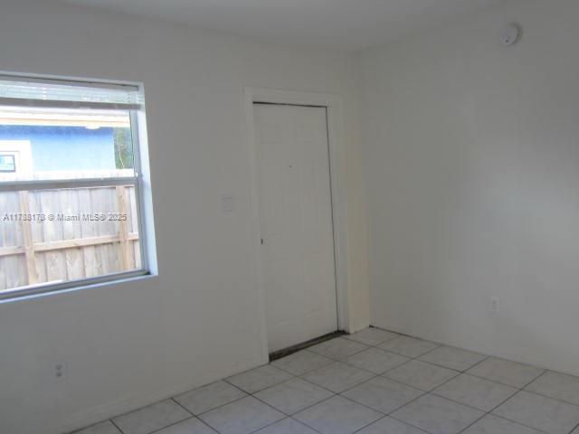 Collier City Pompano Beach, FL 33069 - Photo 34 of 53 a view of an empty room with a window
