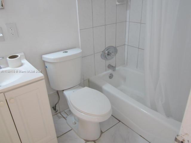 Collier City Pompano Beach, FL 33069 - Photo 37 of 53 a white toilet sitting next to a bath tub