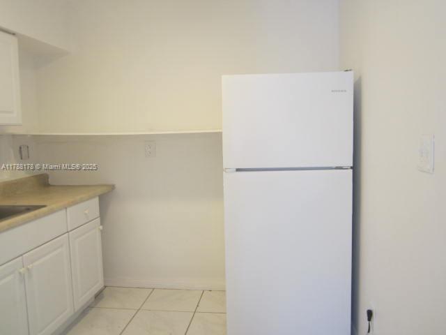 Collier City Pompano Beach, FL 33069 - Photo 40 of 53 a utility room with cabinets washer and dryer