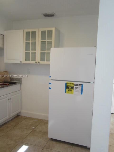Collier City Pompano Beach, FL 33069 - Photo 4 of 53 a white refrigerator freezer sitting in a kitchen