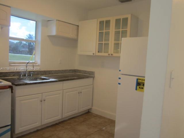 Collier City Pompano Beach, FL 33069 - Photo 8 of 53 a bathroom with a sink and a mirror