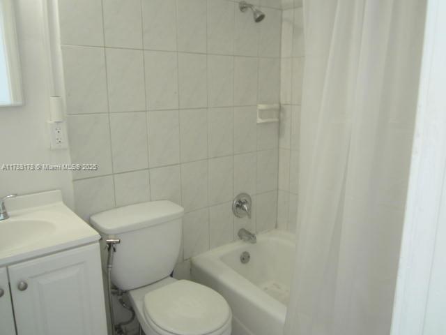 Collier City Pompano Beach, FL 33069 - Photo 10 of 53 a white toilet sitting next to a bath tub