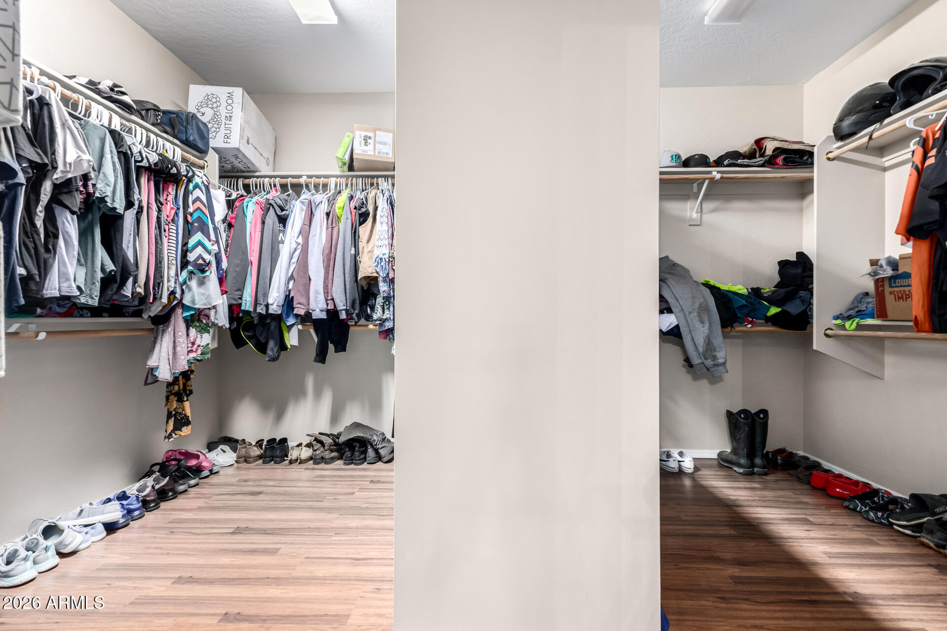 24541 Plum Road Florence, AZ 85132 - Photo 22 of 47 a view of walk in closet with clothes and shoes