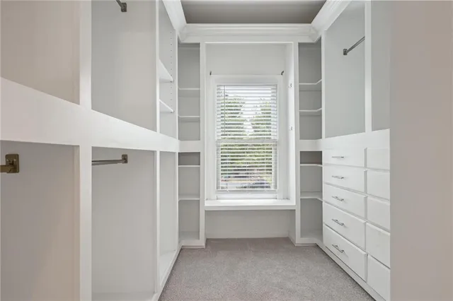 a view of an empty walk in closet
