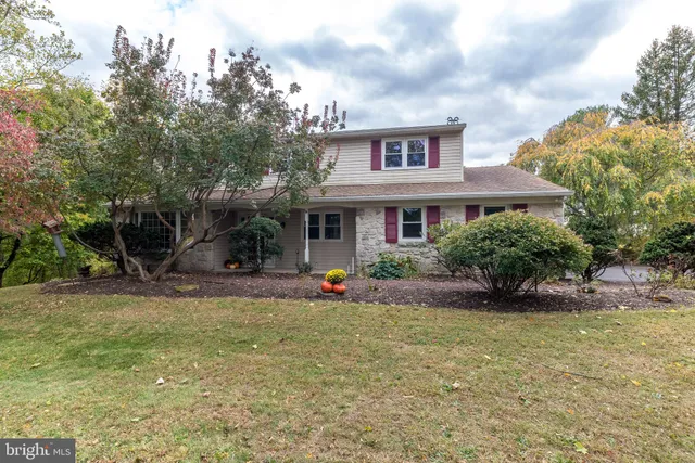 a view of a house with backyard porch and sitting area