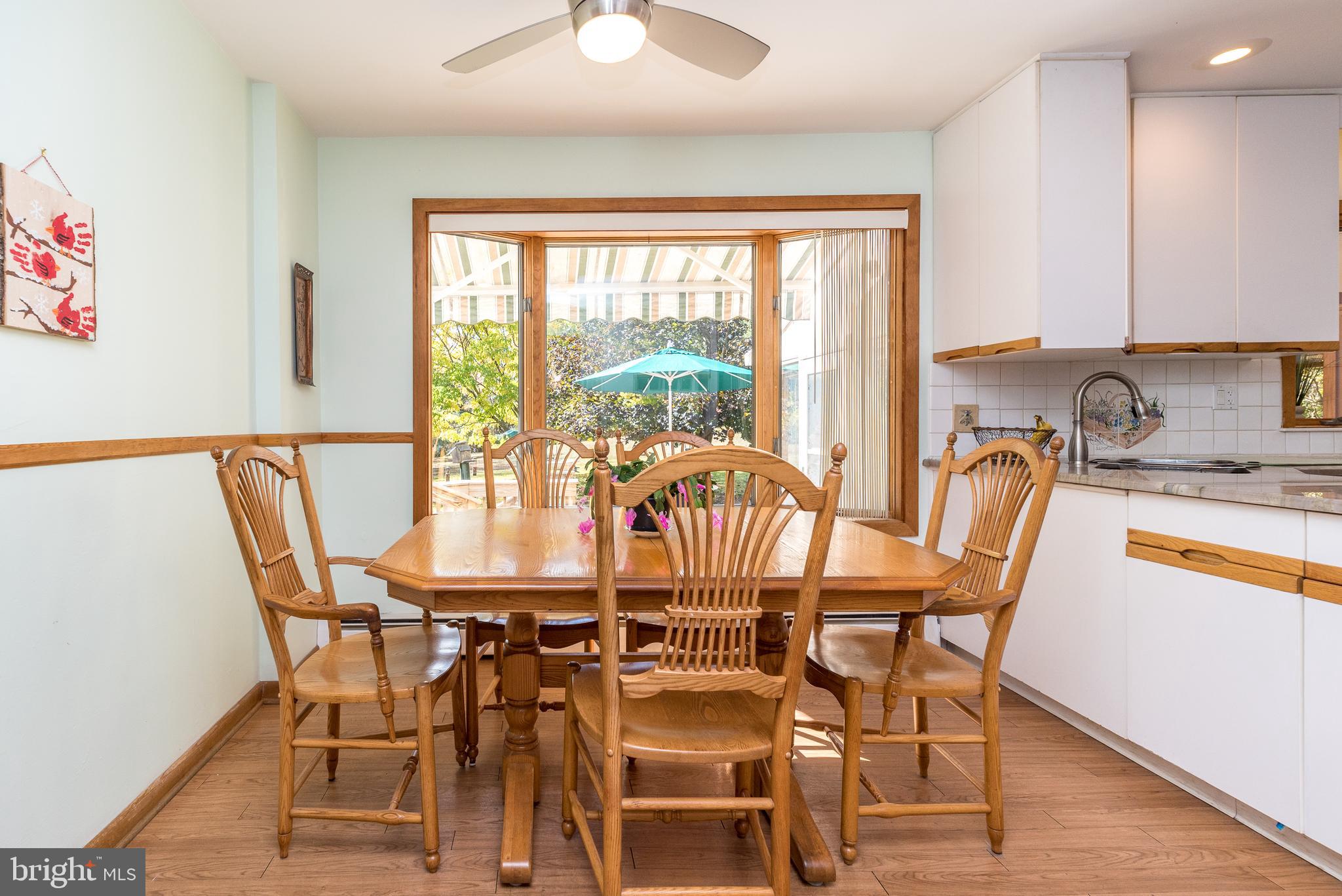 2728 Red Gate Drive Doylestown, PA 18902 - Photo 13 of 42 a view of a dining room with furniture a chandelier and wooden floor