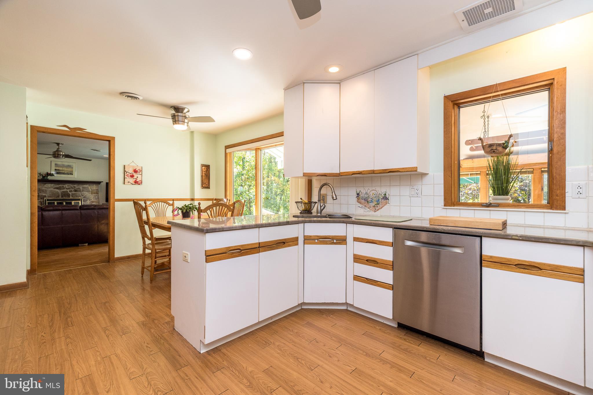 2728 Red Gate Drive Doylestown, PA 18902 - Photo 14 of 42 a kitchen with stainless steel appliances granite countertop wooden cabinets a stove a sink and a microwave