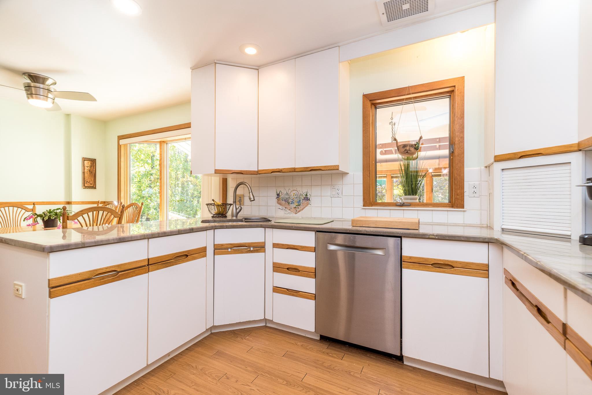 2728 Red Gate Drive Doylestown, PA 18902 - Photo 15 of 42 a kitchen with stainless steel appliances granite countertop a stove a sink and a microwave