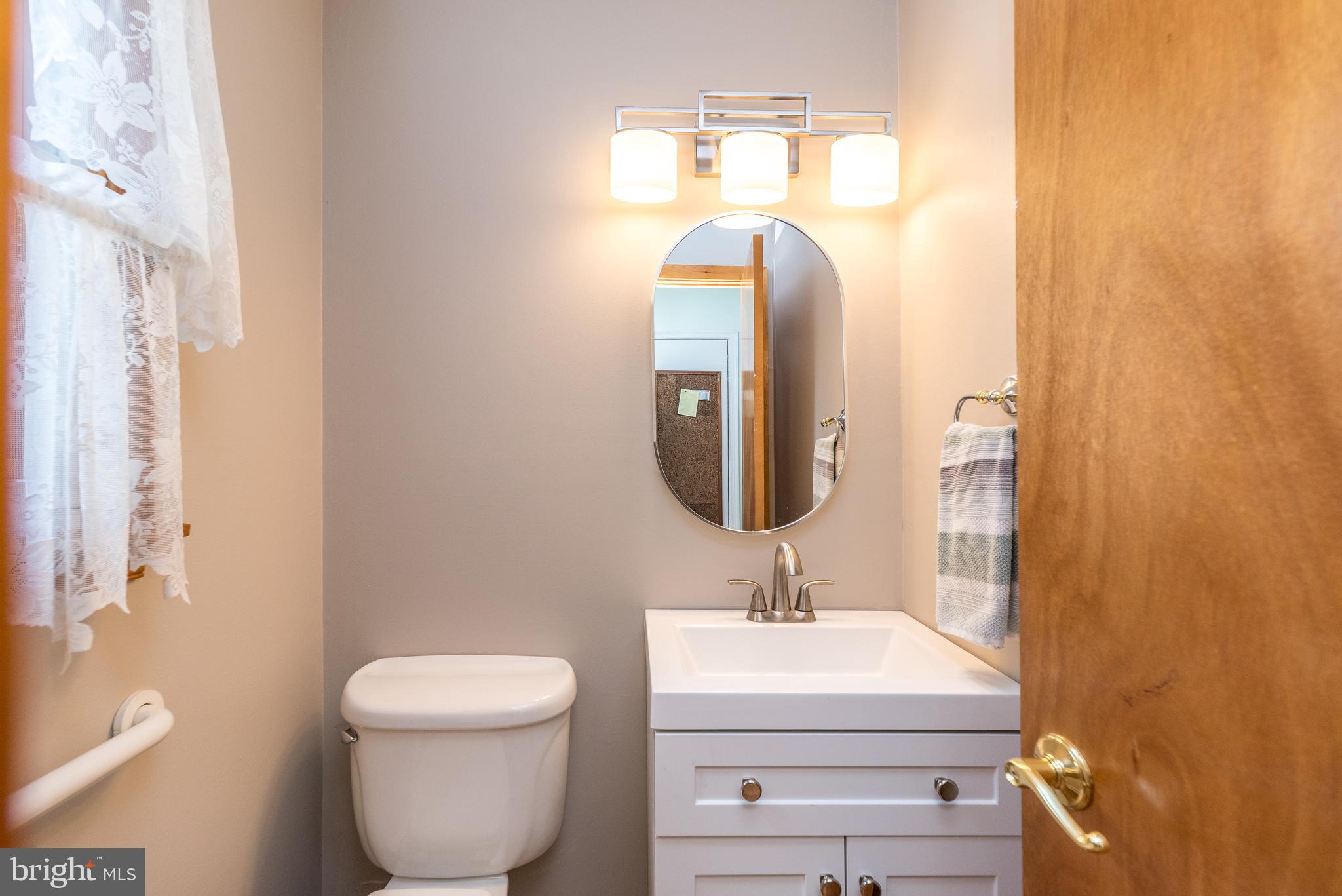 2728 Red Gate Drive Doylestown, PA 18902 - Photo 18 of 42 a bathroom with a toilet sink and mirror