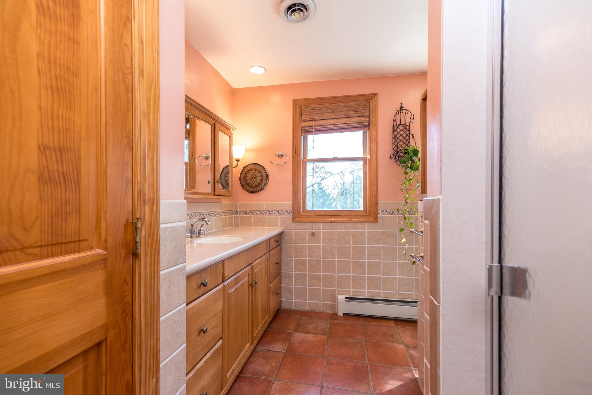 2728 Red Gate Drive Doylestown, PA 18902 - Photo 25 of 42 a bathroom with a granite countertop sink and a mirror