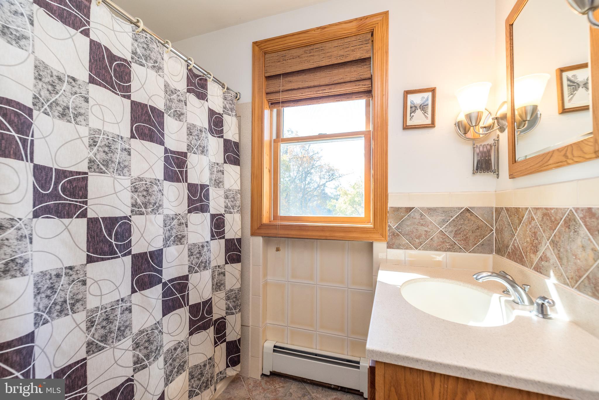 2728 Red Gate Drive Doylestown, PA 18902 - Photo 30 of 42 a bathroom with a sink and a bathtub