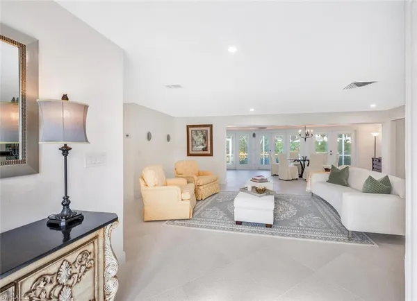 a living room with furniture and a table