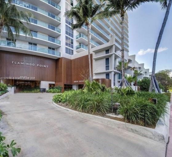 1500 Bay Road, Unit 866S Miami Beach, FL 33139 - Photo 17 of 19 a front view of a building with garden