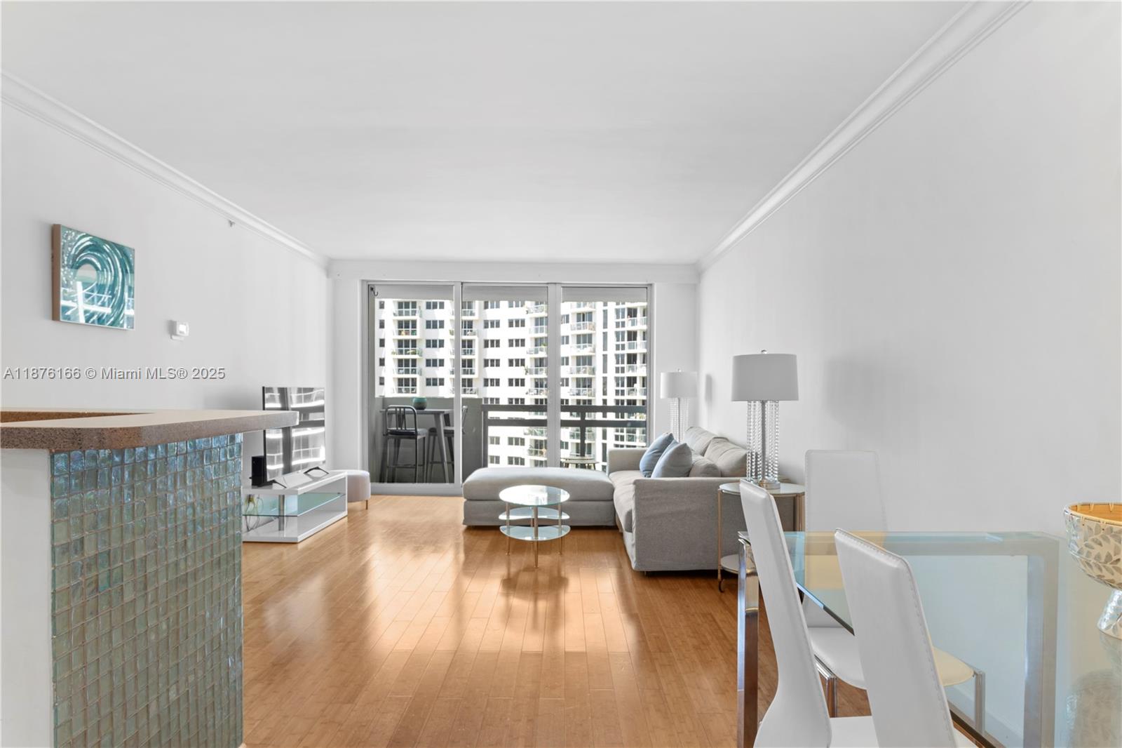 1500 Bay Road, Unit 866S Miami Beach, FL 33139 - Photo 5 of 19 a living room with furniture and a wooden floor