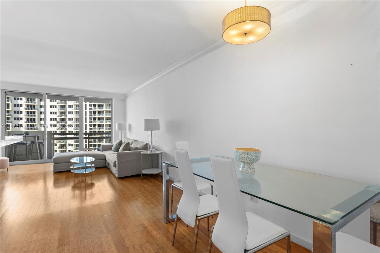 1500 Bay Road, Unit 866S Miami Beach, FL 33139 - Photo 7 of 19 a living room with fireplace furniture and a large window