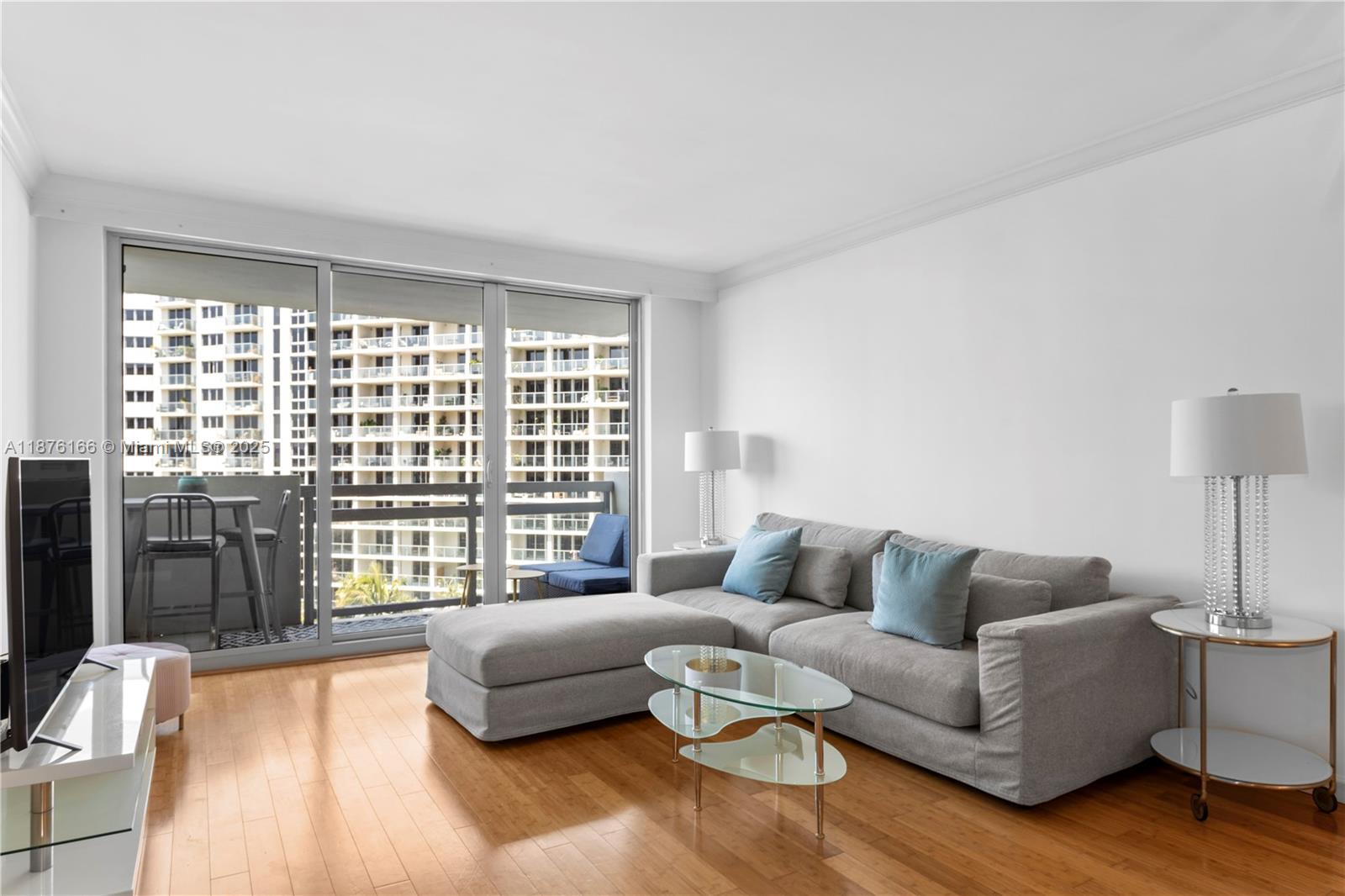 1500 Bay Road, Unit 866S Miami Beach, FL 33139 - Photo 10 of 19 a living room with furniture and a large window