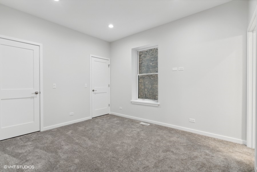 1220 West Roscoe Street Chicago, IL 60657 - Photo 12 of 35 a view of an empty room with a window