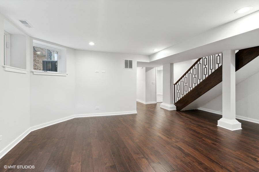 1220 West Roscoe Street Chicago, IL 60657 - Photo 14 of 35 a view of an entryway with wooden floor