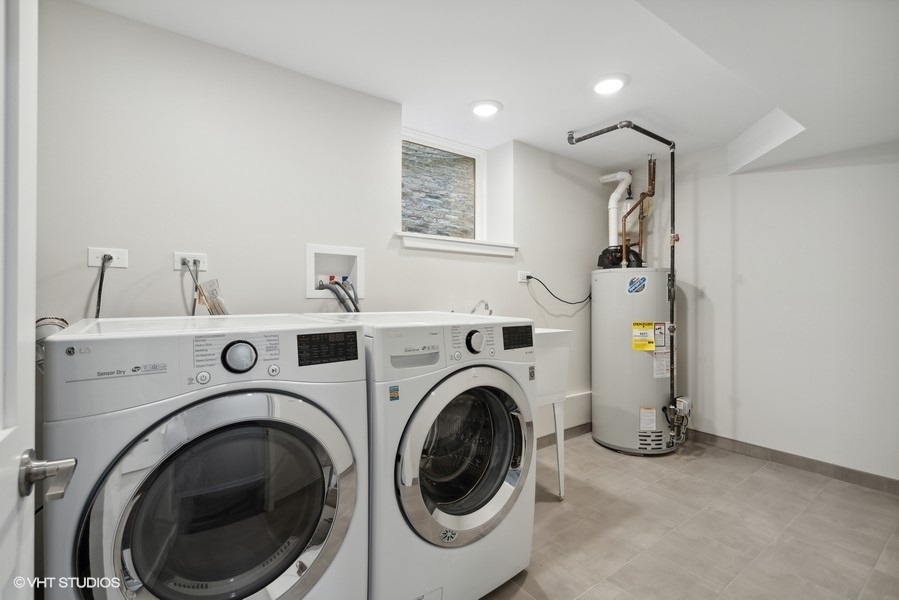 1220 West Roscoe Street Chicago, IL 60657 - Photo 19 of 35 a utility room with dryer and washer