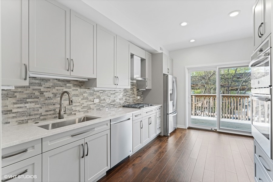 1220 West Roscoe Street Chicago, IL 60657 - Photo 28 of 35 a kitchen with sink and cabinets