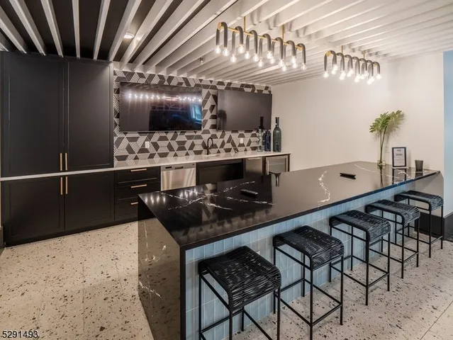 a kitchen with a table and chairs in it