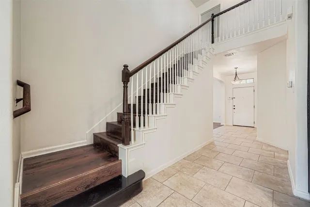 a bathroom with a double vanity sink mirror and toilet