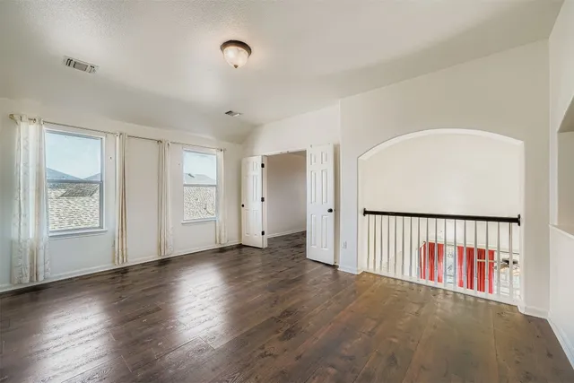 a view of balcony with wooden floor