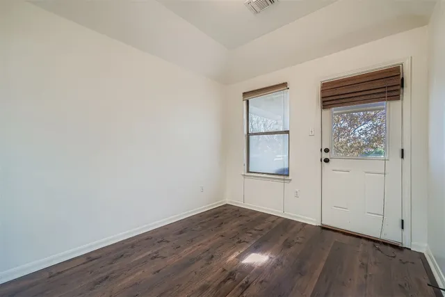 a building outdoor space with patio furniture and potted plants