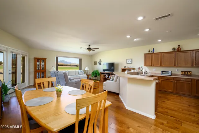 a large kitchen with a table and chairs