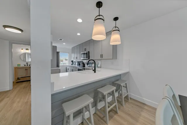 a kitchen with a stove and a refrigerator