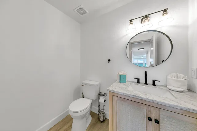 a bedroom with a large bed and a large window